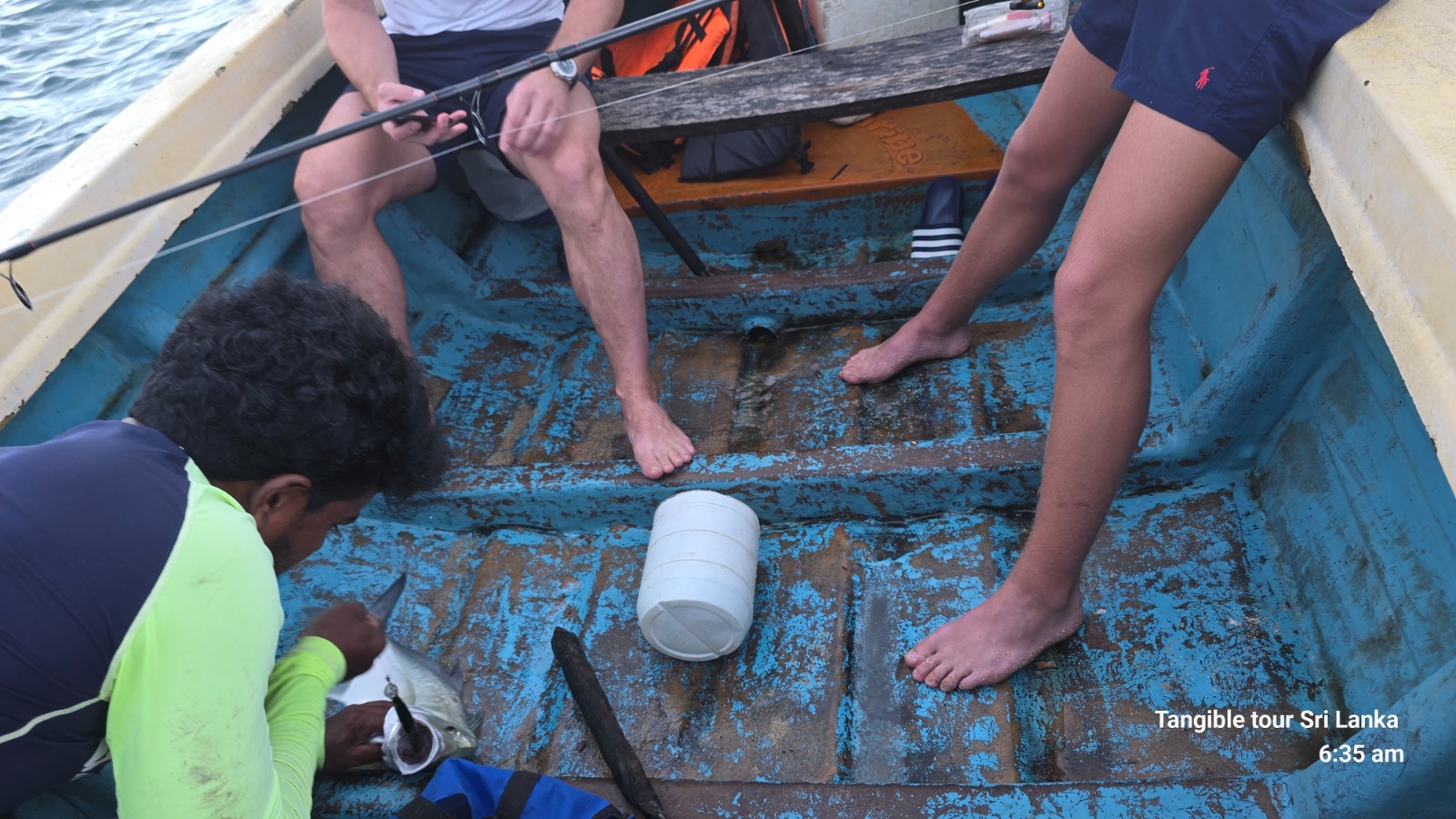Anglers showing off their catch on the boat